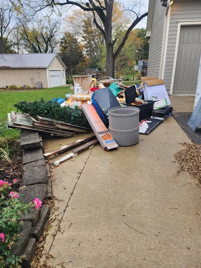 Dumpster being loaded with debris for Estate Cleanout Dumpster Rental in Marion